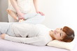 young japanese woman receives chiropractic