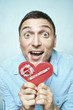 Crazy happy guy holding red valentine card