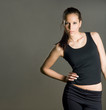 Gorgeous young fitness brunette poser.