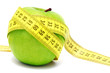 Green apple and measuring tape