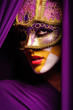 Foto: portrait of woman in violet mask portrait of woman in violet mask