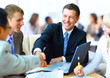 Business people shaking hands, finishing up a meeting