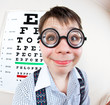 person wearing spectacles in an office at the doctor