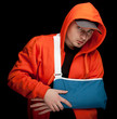young man with broken hand wearing an arm brace