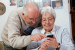 senior couple with smartphones