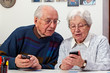 senior couple with smartphones