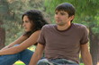 Young couple unhappy in a park setting