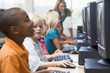 Kindergarten children learning how to use computers.