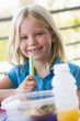 Girl eating lunch at kindergarten