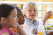 Kindergarten children eating lunch