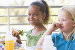Kindergarten children eating lunch