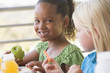 Kindergarten children eating lunch
