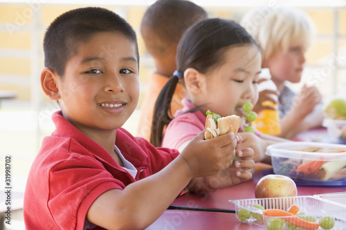 Photo: Kindergarten children eating lunch Kindergarten children eating lunch