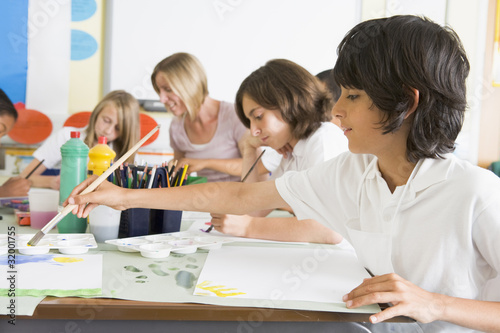 Photo: Schoolchildren and their teacher in an art class Schoolchildren and their teacher in an art class