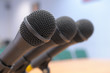 Microphones stand at conference.