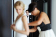 Groom watching his beautiful bride getting ready