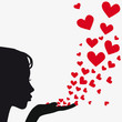 Silhouette woman blowing heart