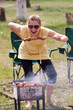 Woman grilling shish kebab