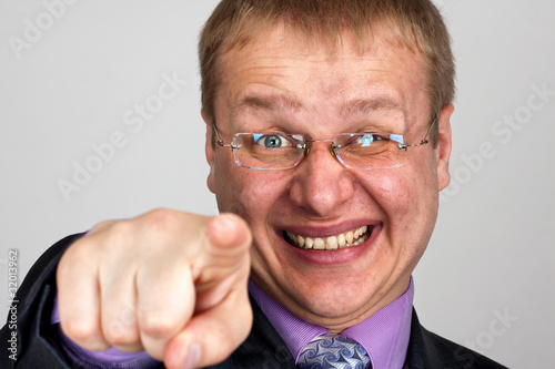 Photo: Funny businessman pointing to you Funny businessman pointing to you