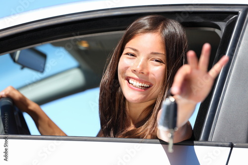 Photo: Girl car driver showing keys Girl car driver showing keys