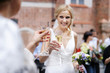 Foto: Bride is holding champagne glass after a wedding ceremony Bride is holding champagne glass after a wedding ceremony