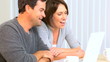 Happy Young Couple Using Online Internet Webchat