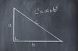 Right triangle with pythagorean formula on a blackboard