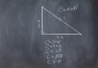 Right triangle with pythagorean formula and calculations on a bl