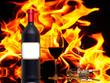 Red wine on a background of fire