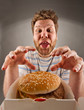 Happy man preparing to eat burger