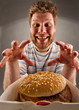 Foto: Happy man preparing to eat burger Happy man preparing to eat burger