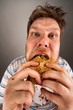 Man chewing hamburger