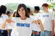 happy volunteer woman and group