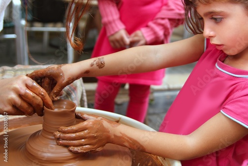 Photo: clay potter hands wheel pottery work workshop pupil clay potter hands wheel pottery work workshop pupil