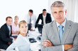 사진:Successful young businessman with his hands folded Successful young businessman with his hands folded