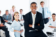 Happy black businessman in office environment