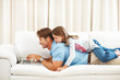 Father and daughter using laptop