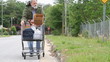 Homeless Man Pushing Cart