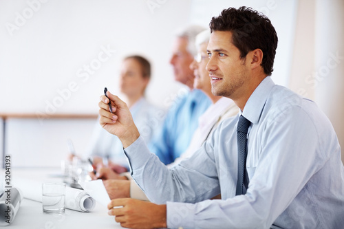 Photo: Business man paying attention in seminar Business man paying attention in seminar
