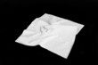 Napkin, A wrinkled napkin on black screen. Napkin, A wrinkled napkin on black screen.