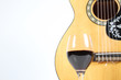 glass wine and guitar isolated on white