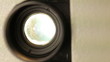 Front view of 8mm film projector lens in action