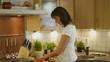 HD1080p25 Attractive woman cooking in the kitchen