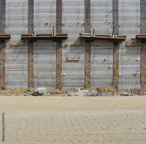 concrete wall construction. concrete wall and sand road on a large construction site