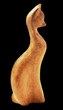 Wooden figure of cat on black background Wooden figure of cat on black background