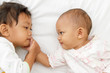 cute little girl and baby playing together cute little girl and baby playing together