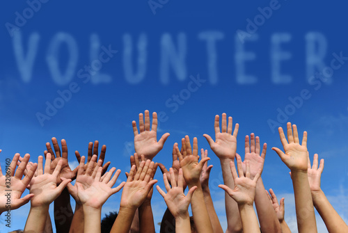 Photo: volunteer group raising hands volunteer group raising hands