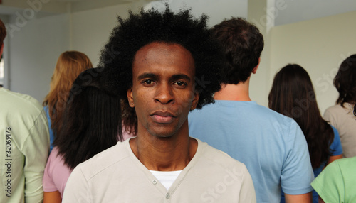 Photo: Mobbing, discrimination or racism: Man and crowd Mobbing, discrimination or racism: Man and crowd