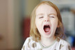 Little funny toddler girl screaming