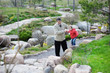 Grandfather and granddaughter walking in a spring park Grandfather and granddaughter walking in a spring park